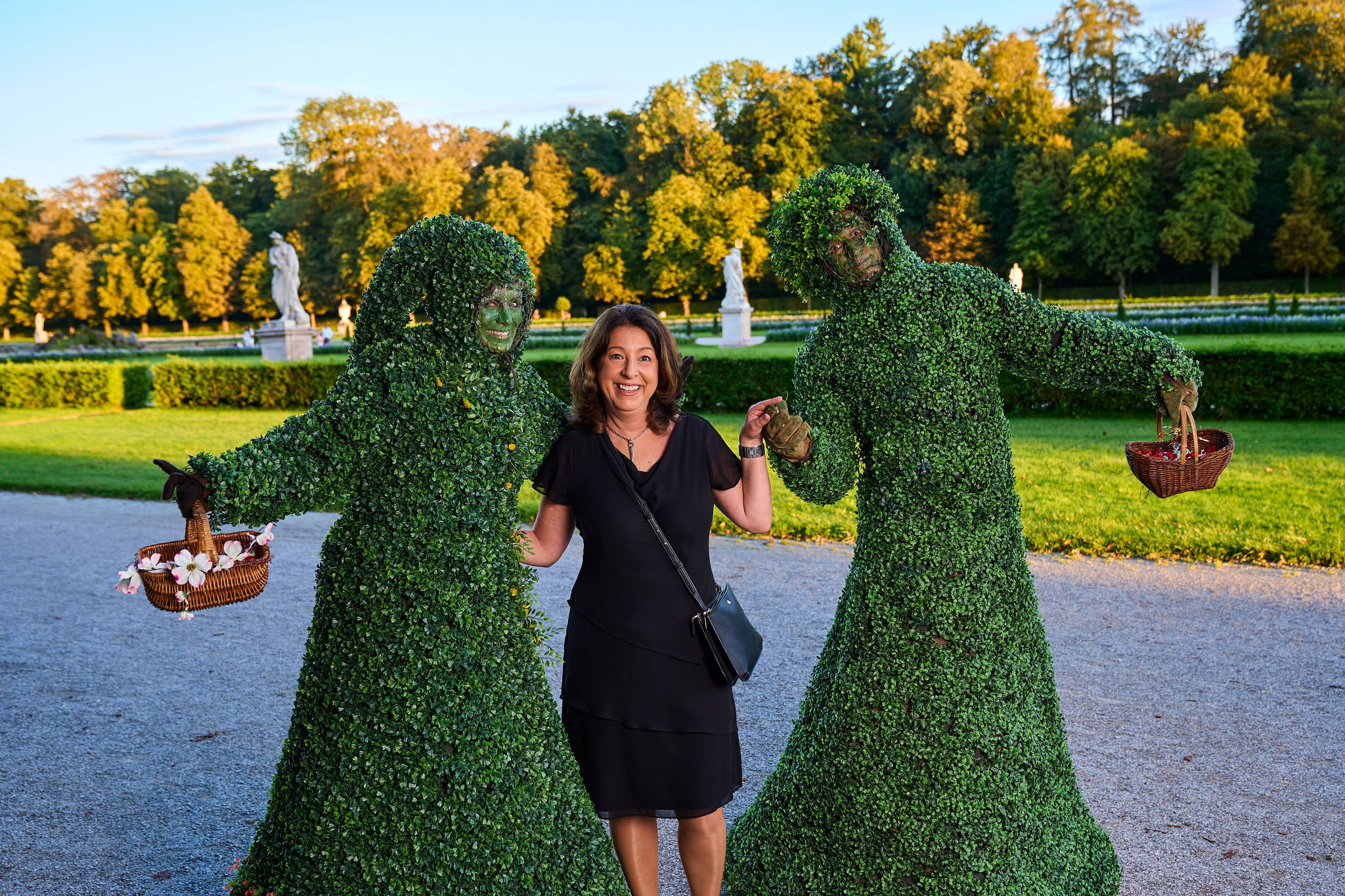 Debbie Lawson between two 'trees' at the 2023 Fundraising Gala